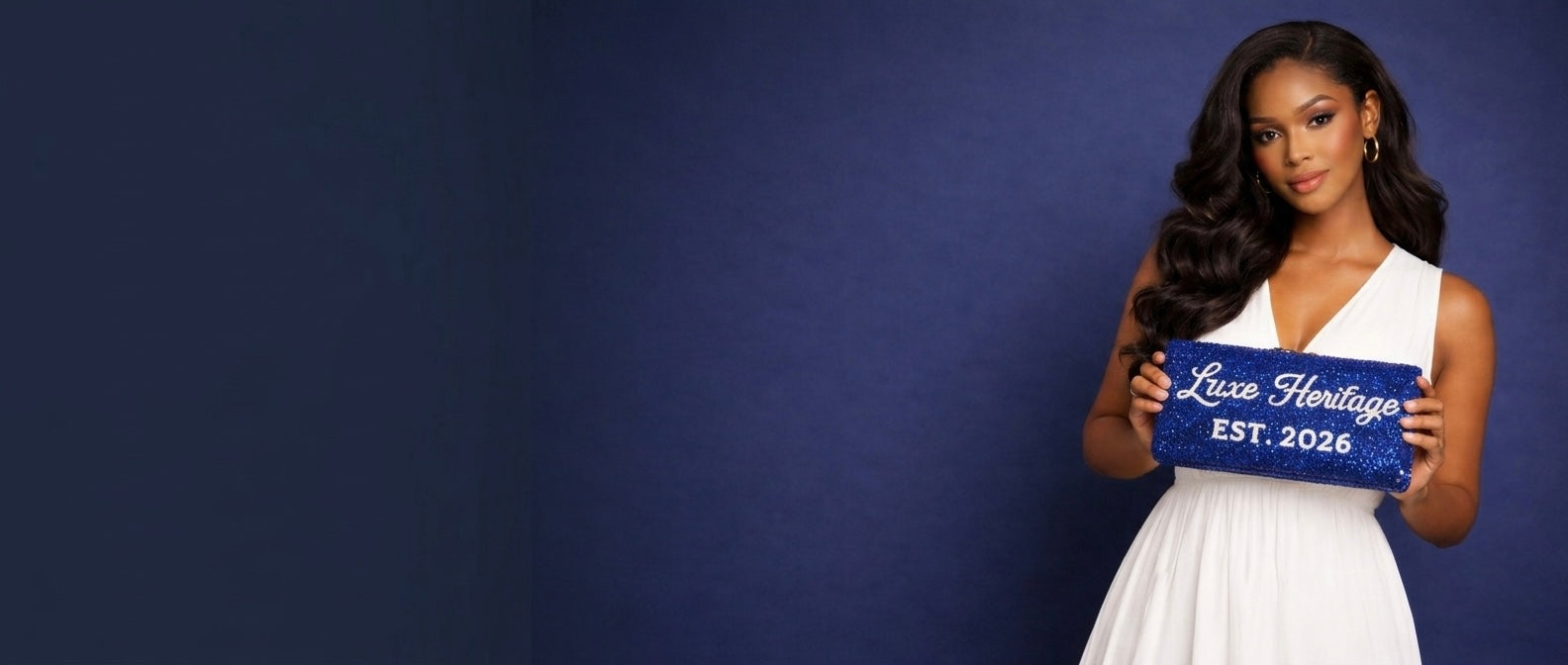Woman holding a blue clutch with 'Luxe Heritage' branding against a dark blue background